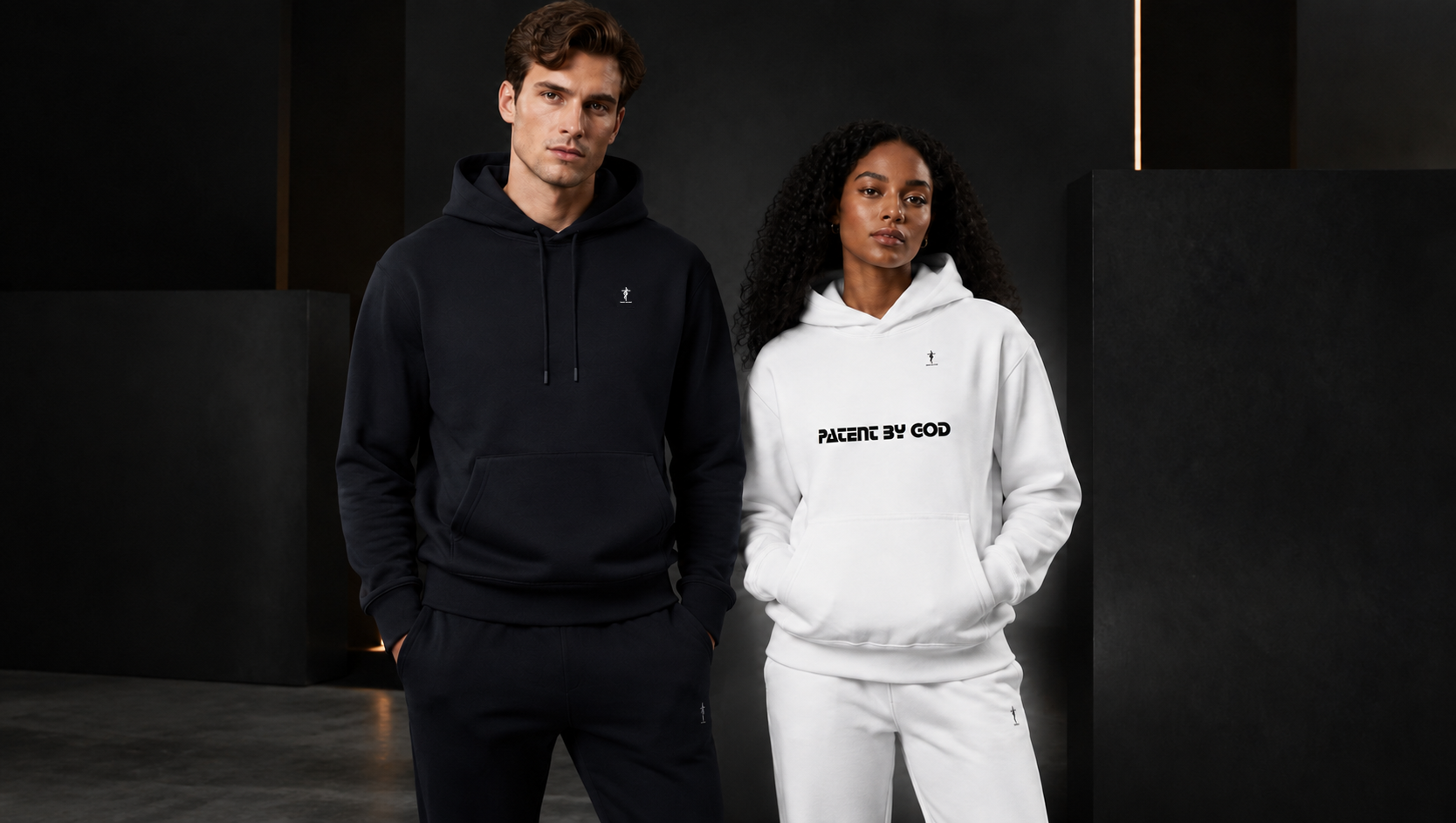 White male and Black female models wearing Patent By God hoodies